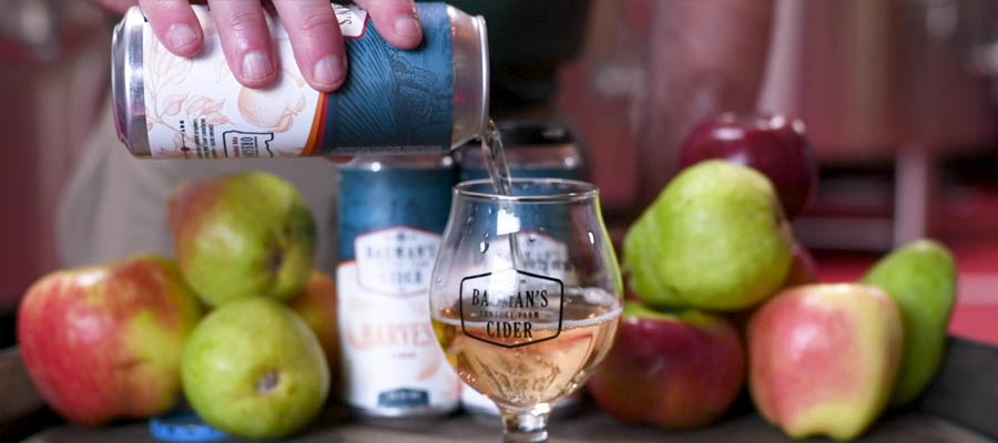 Pouring Bauman Cider from a Can - Pears & Apples